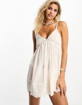 ASOS DESIGN halter cross neck linen look plunge mini beach dress in natural