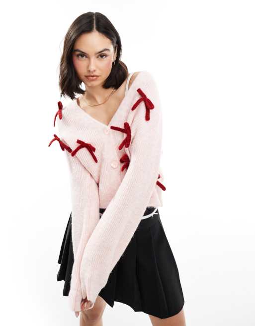 Miss Selfridge - Cardigan rosa tenue con dettaglio con fiocchi rossi