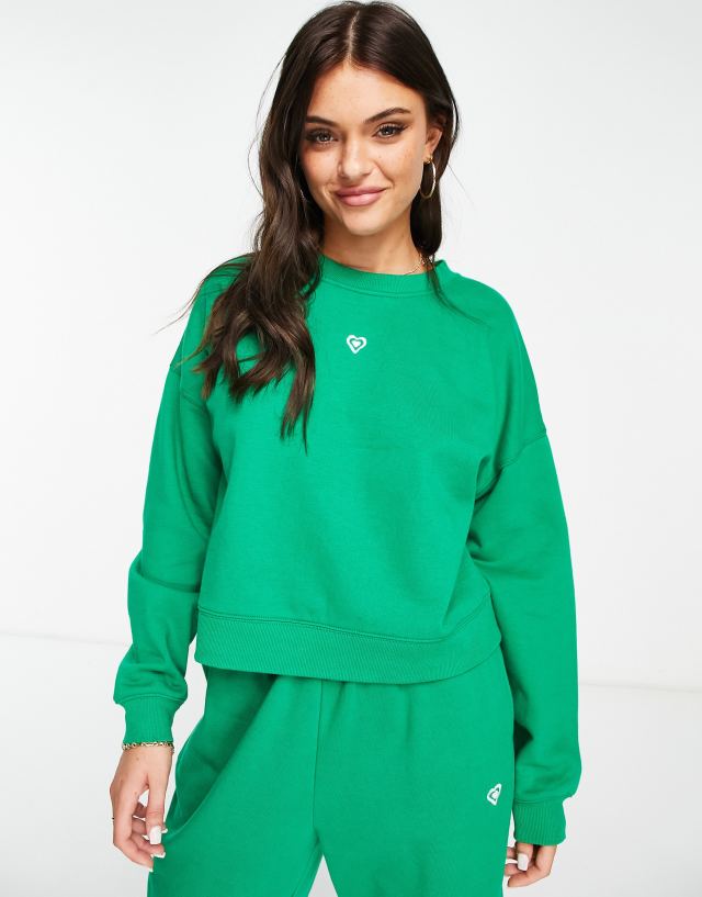 Miss Selfridge - co-ord sweatshirt in green with heart embroidery