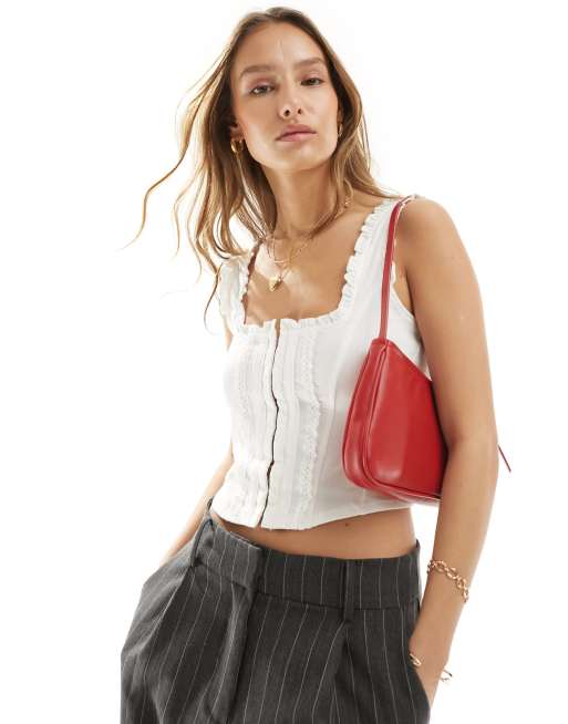 Miss Selfridge - Corsetto color crema con occhielli e volant