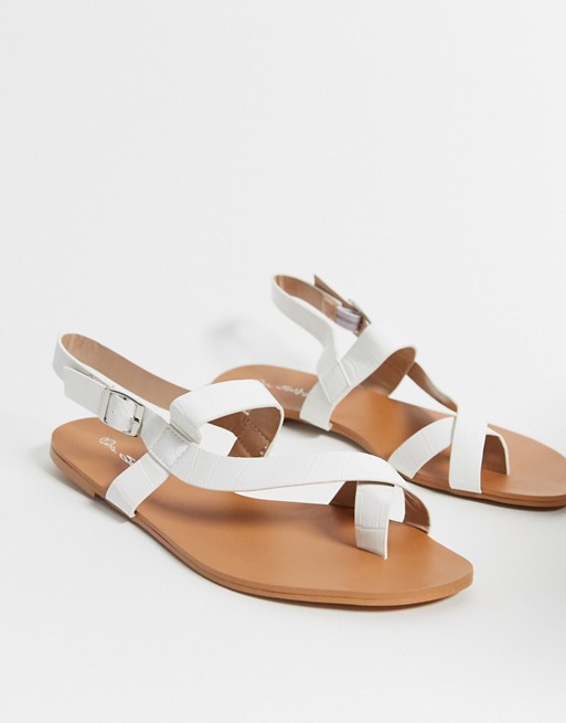 Miss Selfridge cross over sandals in white
