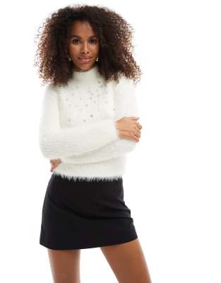 embellished lash funnel neck long sleeve sweater in cream-White