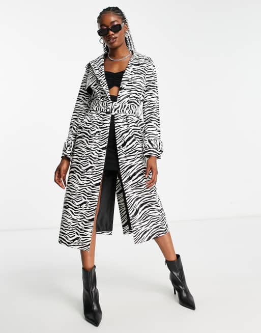 zebra print leggings with leather jacket and metallic accessories