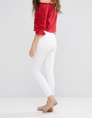 white skinny jeans with frayed hem