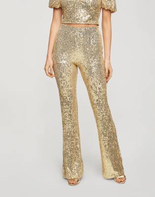 Miss Selfridge - Kickflare broek met lovertjes in goud | ASOS