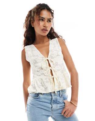 lace sleeveless tie front top in light beige-White
