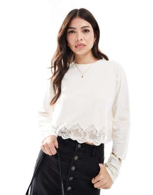 long sleeve lace hem detail top in cream-Neutral