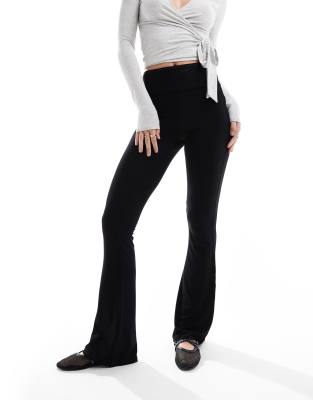 low rise deep fold over waistband flare legging in black