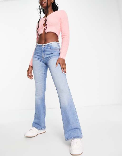 Miss Selfridge low rise raw waistband flare jeans in mid wash blue