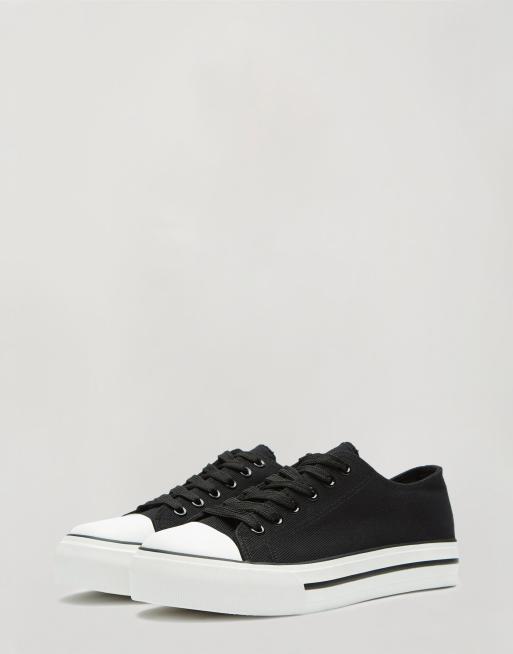 Miss Selfridge low top trainers in black