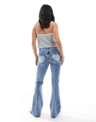 Shop Miss Selfridge Petite Heart Pocket Flare Jeans