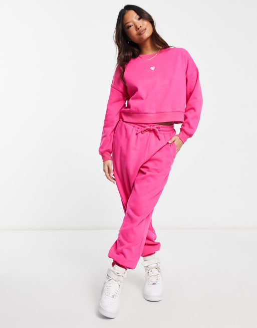 Miss Selfridge Petite lounge slim sweatpants with emb in pink | ASOS