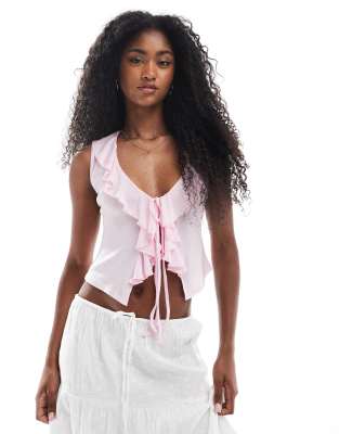 sheer stretch jersey ruffle tie front top in light pink