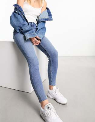 Shop Miss Selfridge Skinny Jeans In Mid Blue Wash