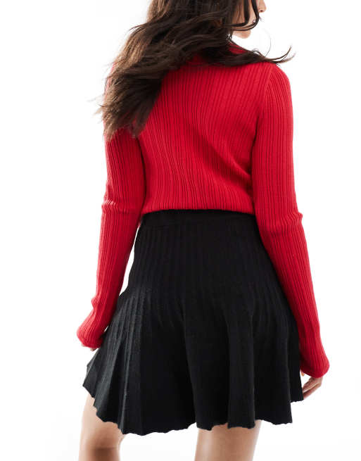 Miss Selfridge – Svart, plisserad, stickad minikjol med vippig design, 2 av 5
