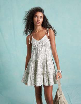 Miss Selfridge Miss Selfridge tiered mini dress with tie cami straps in white ditsy print