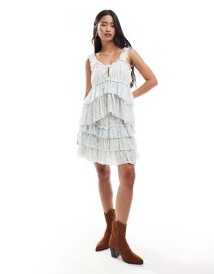 Miss Selfridge tiered mini skirt in blue ditsy print