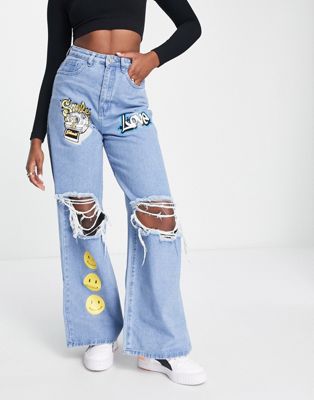 Missguided love graffiti style jeans in blue