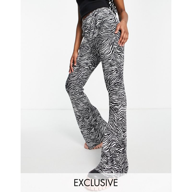 Pantaloni e leggings 4Q84C Missguided - Pantaloni plissé a fondo ampio con stampa zebrata