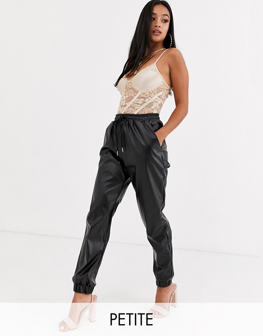 Missguided Petite faux leather joggers in black