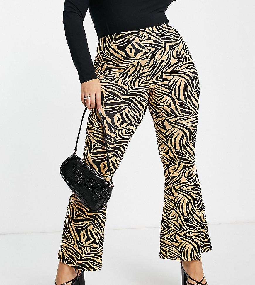 Plus-size leggings by Missguided Exclusive to ASOS Zebra design High rise Elasticated waist Flared skinny fit
