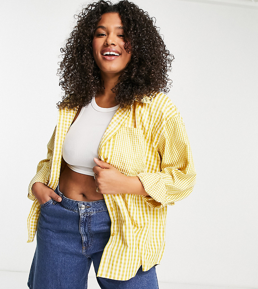 Plus-size shirt by Missguided Exclusive to ASOS Spread collar Zip fastening Functional pockets Regular fit
