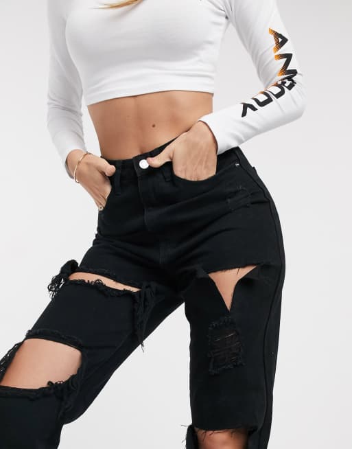 Missguided riot mom jeans with distressed rips in black ASOS