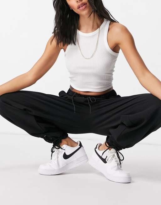 Missguided trackies with tie hem in black ASOS