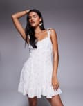 [Missyempire] Missy Empire ruffle strap tie back mini dress in white floral 42 White Floral