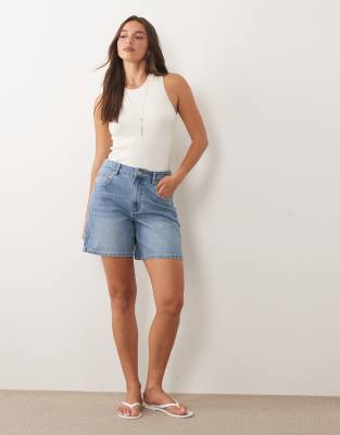Missyempire denim longline shorts in mid blue wash
