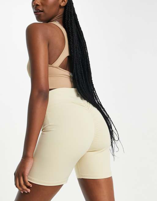 Missyempire sport ruched bum gym shorts in cream