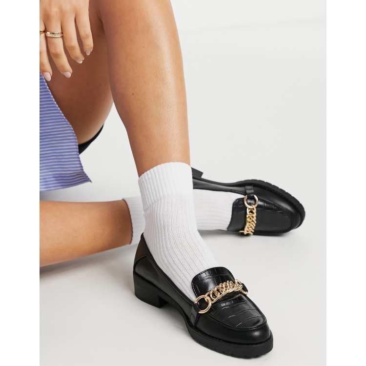 Mocasines negros con bridón dorado de y suela de |