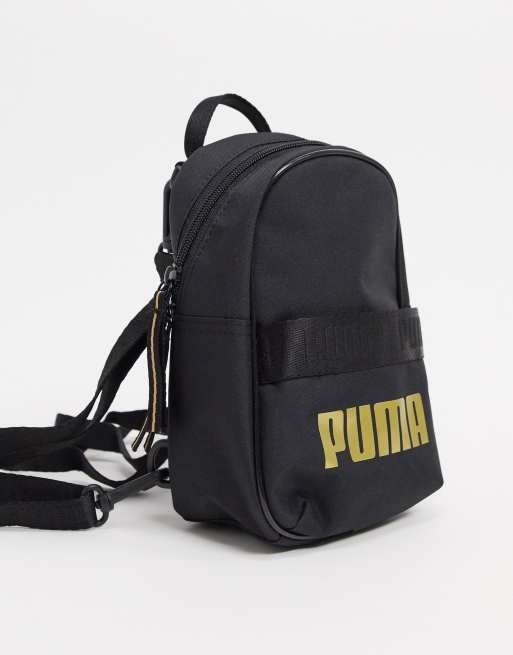 Mochila negra con logo dorado Minime de Puma ASOS