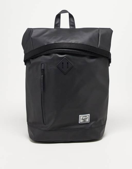 Mochila negra con parte superior plegada de Herschel Supply Co