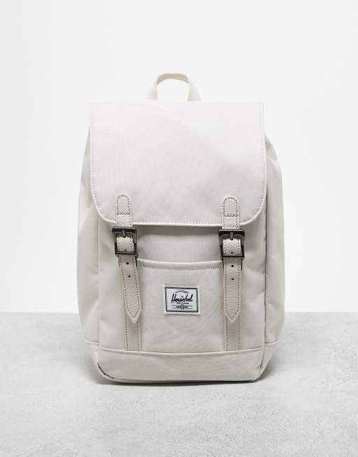 Mochila pequeña color crema de Herschel Supply Co