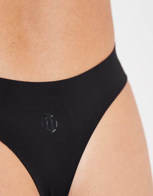 Modibodi Seamfree light absorbency period thong in black, 4 of 5