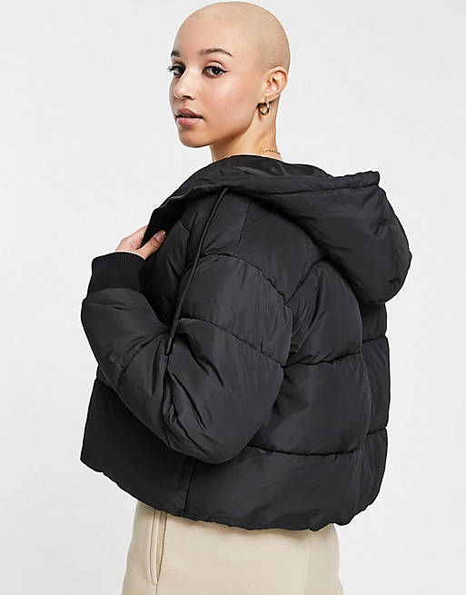 Coats & Jackets Monki Amber recycled short padded jacket with hood in black 