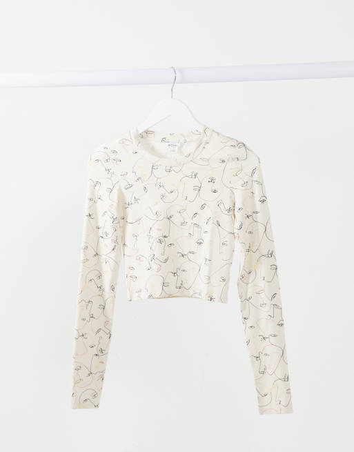 Monki – Barb – T-Shirt aus Baumwolljersey in Weiß mit Gesichtermuster 