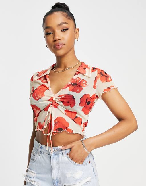 Monki - Bluse med multifarvet blomsterprint og bindebånd foran