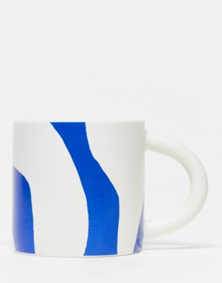 Monki bold spring print mug in blue and white