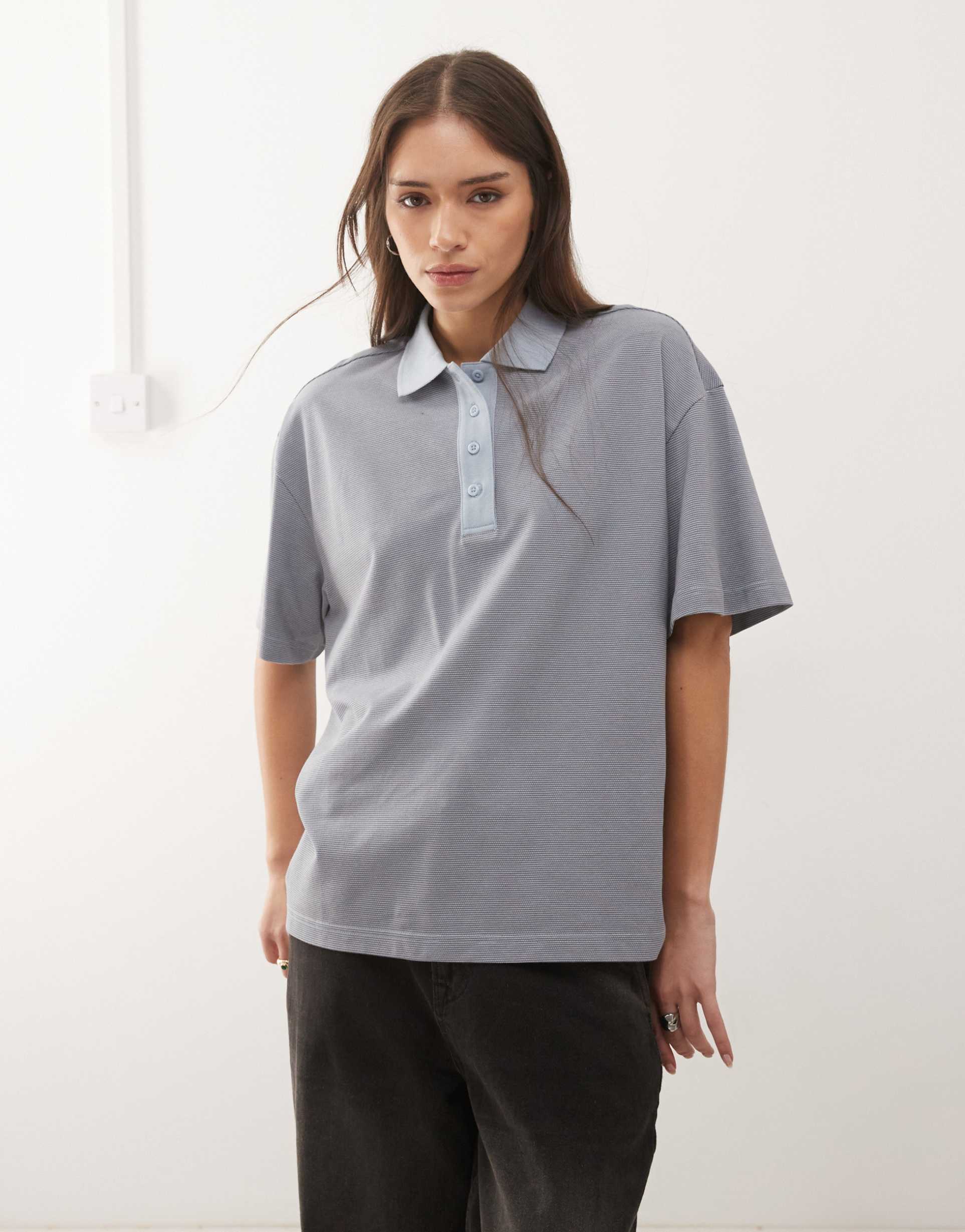 monki boxy fit short sleeve polo shirt in blue stripes