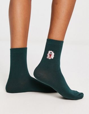 Monki Christmas print sock in green