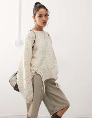 chunky cable knit sweater with tie details in off white melange