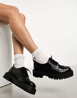 Monki chunky lace up brogue shoe with cleated sole in black