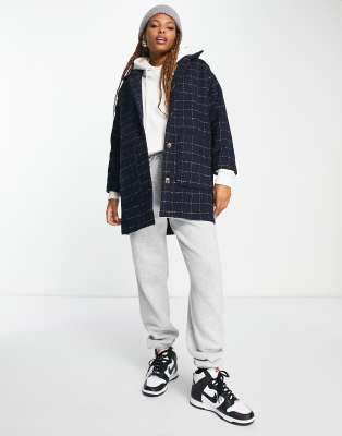 collared coat with patch pockets in navy grid plaid
