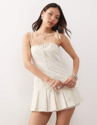 Monki cotton drop waist mini dress with pleated skirt in white - view 1