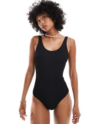 Monki crinkle swimsuit with low back in black