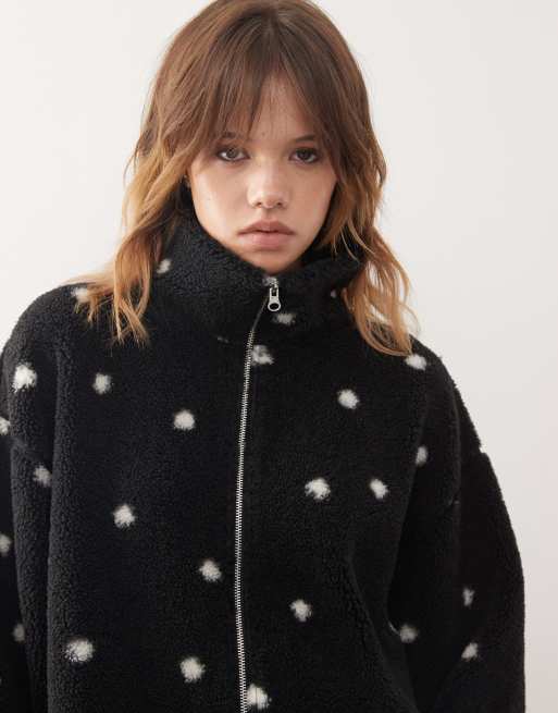 Monki cropped zip up fleece with cinch toggle detail in black and white polka dot