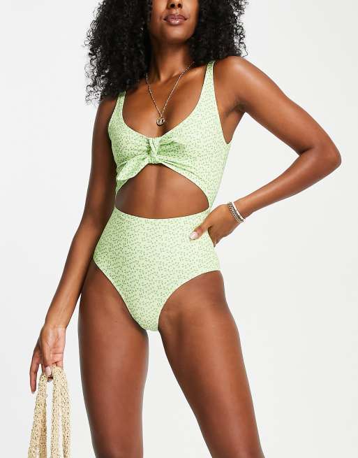 Monki cut out swimsuit in green floral LGREEN