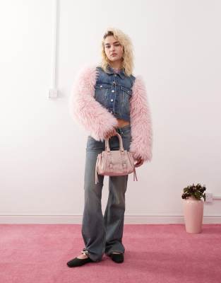 Monki denim jacket in mid wash blue with pink faux fur sleeves